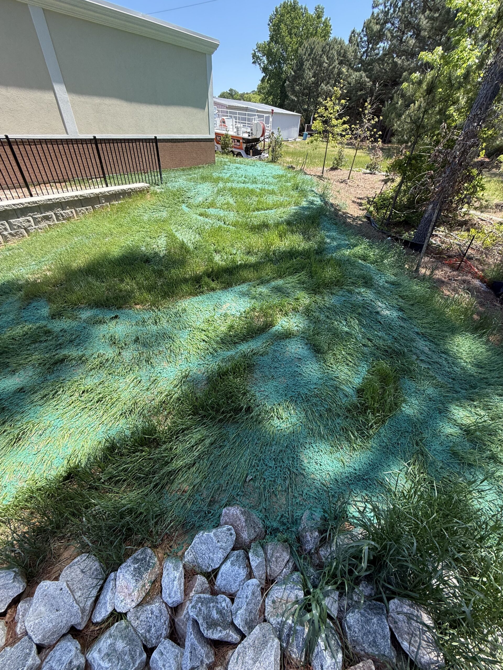 Hydroseeding a graded lot in Hopewell, Virginia